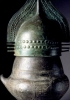 Urna biconica, VII secolo a.C. Urna in ceramica; coperchio in lamina di bronzo, altezza 71 cm. Da Tarquinia (Viterbo). Firenze, Museo Archeologico Nazionale. 